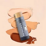 Kryolan TV Paint Stick Foundation displayed with multiple shade swatches in background