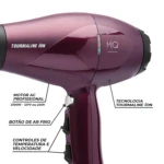 MQ Hair Tourmaline Ion Dryer close-up – Temperature and speed controls, AC motor, cool shot button, and precision nozzle attachments.